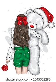 A girl with beautiful hair and a teddy bear. New Year's and Christmas.