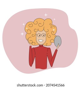 A girl with a beautiful hairstyle looks in the mirror.