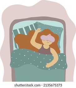 Girl in a bed in sleeping mask 