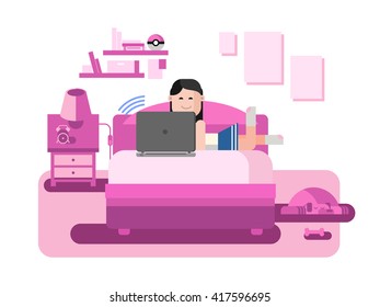 The girl behind the computer lying on sofa