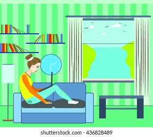 the girl behind the laptop on the couch