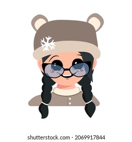 Girl with big eyes with glasses and wide smile and black hair in bear hat with snowflake. Cute child with happy expression in winter headdress. Head of adorable kid with emotions