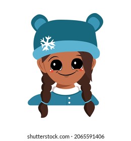 Girl with big eyes and a wide smile of African American or Latin nationality in bear hat with snowflake. Cute baby with happy face in winter headdress. Head of adorable child with emotions
