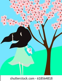 A girl with black hair makes a selfie in front of a blooming spring tree