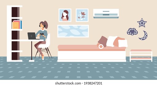 girl blogger commentating game process video review blogging live streaming concept gamer in headphones using gamepad playing games on laptop living room interior full length horizontal