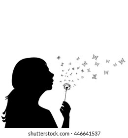 Girl blowing on dandelion and the seeds are transforming into butterflies