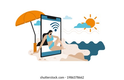 Mädchen in blauen Badeanzügen sitzen am Strand im Smartphone. Lade das Handy auf den Sand. Sommer online auf dem abstrakten Banner am Strand. Sonnenschirm hinter dem Smartphone.