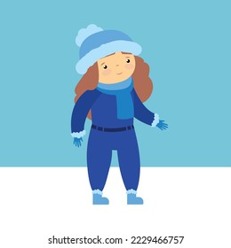 girl in blue overalls on a winter walk
