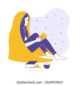 Girl with a book under a blanket