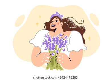 Girl with bouquet of wild flowers enjoys aroma of bouquet collected in forest and wants to put them in vase. Female teenager rejoices at arrival of spring and opportunity to collect wildflowers