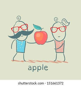 girl and boy holding an apple