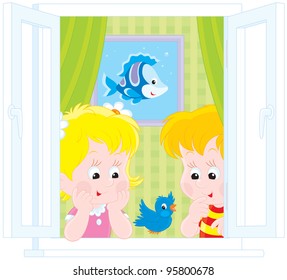 Girl and boy looking out of a window and watching a sparrow