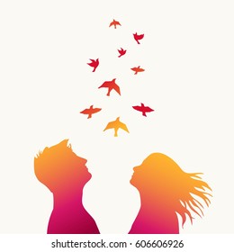 The girl and boy with swarm of birds.