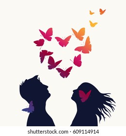 The girl and boy with swarm of butterflies
