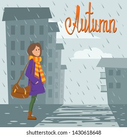 girl in bright clothes standing in the rain against the background of houses