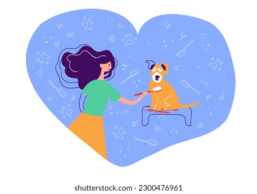 The girl brushes the dog's teeth. Oral hygiene for dogs of all breeds.  Dog dental visuals. Dental care images. Gum disease prevention.  Dental care. Raising awareness of oral hygiene for dogs