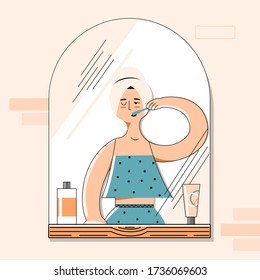 Girl brushes her teeth in the bathroom with a towel on her head and looks in the mirror. Vector flat illustration