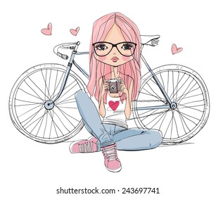 girl with a camera and bicycle