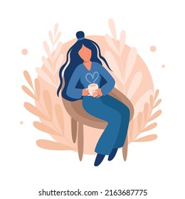 Girl in a chair with lush hair drinks coffee or tea. Cozy interior