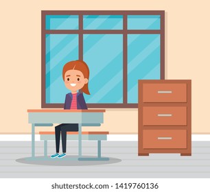 girl child in the classroom with desk and window