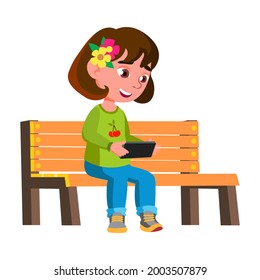 Girl Child Playing Video Game On Smartphone Vector. Smiling Caucasian Preteen Lady Sitting On Park Bench And Watching Video Movie On Smartphone Screen. Character Gadget Flat Cartoon Illustration