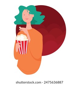 A girl in the cinema eats popcorn