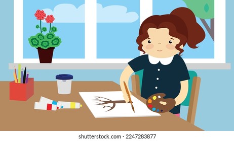 A girl in the classroom draws a tree at her desk