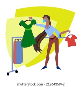 A girl in a clothing store makes a choice between a blouse and a dress