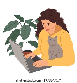 Girl at the computer with a cat.Girl programmer sitting with a pet. Curly woman in a yellow skinny.