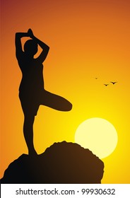 The girl costs in a yoga pose against a sunset
