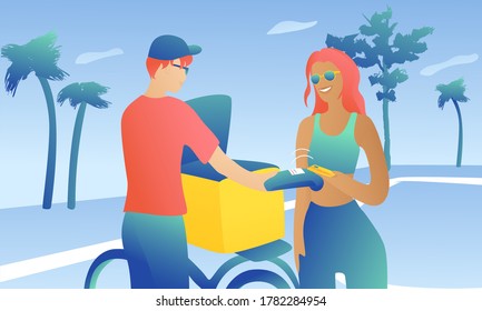 A girl with a courier on the sportsground is conducting a monetary transaction. The woman pays by card. A man in a cap with a bicycle holds a wireless terminal.