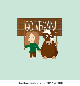 girl and cow holding a sign of GO VEGAN