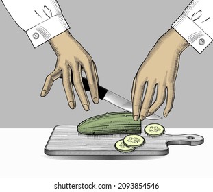 The girl cuts a cucumber. The theme of cuisine, healthy eating. 