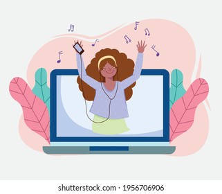 girl dancing listening music on laptop