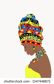 Girl  with dark skin with a turban on the head  (profile view).The girl tilted her head. Young girl pensive and modest 
