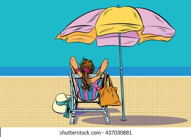 Girl in a deckchair on the beach