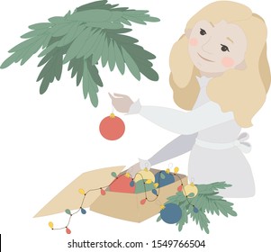 Girl decorates a Christmas tree for the winter holidays. Merry Christmas and Happy New Year.