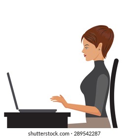 The girl at the desk working on the computer.