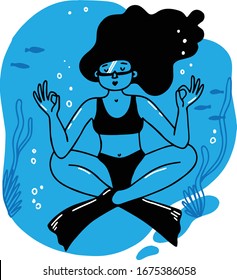 A girl diver in flippers meditates underwater, around fish, algae and air bubbles
