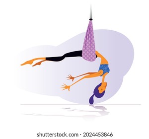 a girl does anti-gravity exercises on a silk hammock