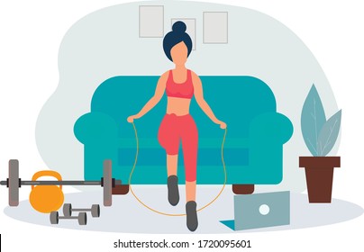 The girl does exercises online-training at home on a skipping rope . Stay at home. Sports online, fitness training. Healthy lifestyle. Keep yourself in shape. Quarantine isolation of the coronavirus. 