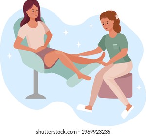 The girl does a foot massage. The procedure of foot massage, hair removal. Beauty salon. Alternative Medicine clinic. Thai massage