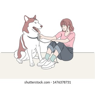 The girl and the dog are sitting tenderly. hand drawn style vector design illustrations.