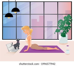 Girl doing yoga in front of window with view to the city