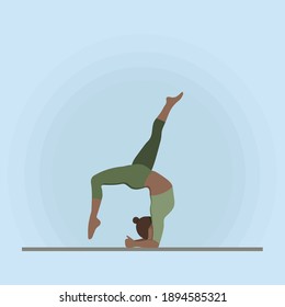 Girl doing yoga in a green tracksuit. Yoga pose on the hands