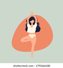 girl doing yoga stands on one leg
