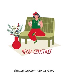 A Girl drinking milk and eating cookies. The child is sitting on the sofa near a vase with a winter bouquet of flowers. Merry Christmas lettering. Vector flat illustration