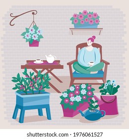 Girl drinking tea with teapot and cups in home garden 