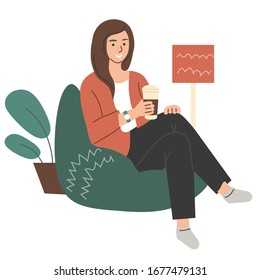 the girl drinks coffee from a Cup with a lid and sits in a comfortable upholstered chair. Vector flat illustration.