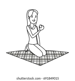girl eating apple on lunch camping blanket